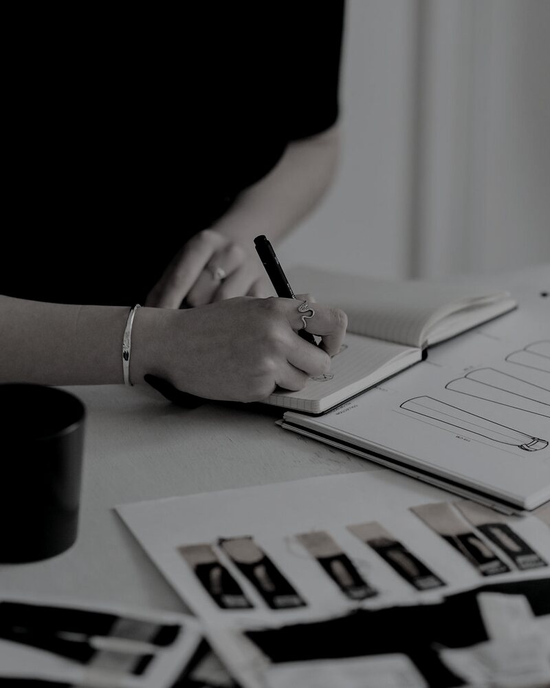 Campaign performance reports and notes on a desk during a strategy review